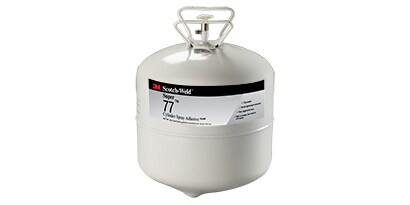 Lijmen op oplosmiddel- en waterbasis gebruiken een vloeibare drager om de lijm op de ondergrond aan te brengen. Afbeelding van lijmspray in een bus.
