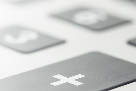 Plus-knop op een toetsenbord
